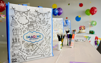 Reusable, canvas Color-Me Tote loot bag at a birthday party.